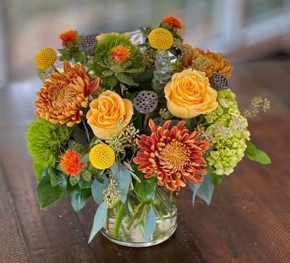 Welcome the arrival of fall as the leaves turn from green to gold. This assortment features blooms of green, gold and yellow.